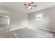 Bright bedroom with gray laminate flooring, neutral walls, and ample natural light at 2909 Glendale Ave, Kannapolis, NC 28081