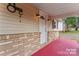 Welcoming front porch with brick accents and a bright white door at 2909 Glendale Ave, Kannapolis, NC 28081