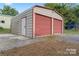 Spacious detached garage with roll-up doors, perfect for storage or a workshop at 2909 Glendale Ave, Kannapolis, NC 28081