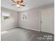 Bright living room featuring stylish gray laminate flooring and a new door at 2909 Glendale Ave, Kannapolis, NC 28081