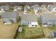 Aerial view of a landscaped backyard with shed and covered patio at 2929 Shumard Dr, Gastonia, NC 28054