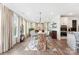 Bright dining room with hardwood floors, large windows, statement lighting, and an accent rug at 2929 Shumard Dr, Gastonia, NC 28054