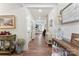 Long hallway with hardwood floors, neutral paint, and decorative touches creating a warm and inviting entrance at 2929 Shumard Dr, Gastonia, NC 28054