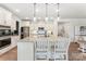 Kitchen island with granite countertop and breakfast bar seating, stainless steel appliances, and pendant lights at 2929 Shumard Dr, Gastonia, NC 28054