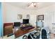 Bright home office with wood desk, ceiling fan, and neutral wall color for a productive workspace at 2929 Shumard Dr, Gastonia, NC 28054