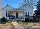 Inviting home features a cozy front porch with seating and a ramp for accessibility at 2940 Ambrose Dr # 6, Gastonia, NC 28056