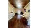 Spacious living room featuring hardwood floors, natural light and a vintage white piano at 2940 Ambrose Dr, Gastonia, NC 28056