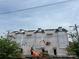 A building under construction with construction workers and equipment, under a blue sky at 3018 Casting St # 20, Charlotte, NC 28206