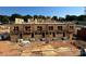 Townhome construction showing framing, window openings, and concrete foundations against a clear blue sky at 3018 Casting St # 20, Charlotte, NC 28206