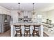 Modern kitchen with stainless steel appliances, a large island, and barstool seating at 3180 Streamside Dr, Davidson, NC 28036