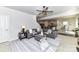 Bright living room showcasing a gray sofa, stylish rug, and open access to the kitchen at 3180 Streamside Dr, Davidson, NC 28036