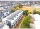 Aerial view of modern townhome complex with green spaces; showcasing urban community design at 3621 Vallette Ct, Charlotte, NC 28203