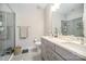 Spacious bathroom features a double vanity, tiled shower with glass door, and modern fixtures at 3621 Vallette Ct, Charlotte, NC 28203