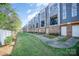 Modern townhome complex with manicured lawn and walkway; a vibrant community setting at 3621 Vallette Ct, Charlotte, NC 28203