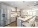 Bright kitchen with stainless steel appliances, white subway tile backsplash, and an island with barstool seating at 3621 Vallette Ct, Charlotte, NC 28203