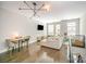 Bright living room featuring hardwood floors, modern lighting, and comfortable seating area at 3621 Vallette Ct, Charlotte, NC 28203