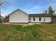 Exterior view of the home with a flat backyard ready for fun and relaxation at 3792 Rolling View Ln, Maiden, NC 28650