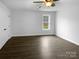 Bright bedroom featuring hardwood floors, a ceiling fan, and a window with a tranquil view at 3792 Rolling View Ln, Maiden, NC 28650