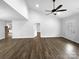 Bright living space with wood-look floors, a vaulted ceiling, and doorways leading to other rooms in the home at 3792 Rolling View Ln, Maiden, NC 28650