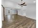 Bright, open living space with wood-look flooring, high ceilings, and multiple doorways leading to other rooms at 3792 Rolling View Ln, Maiden, NC 28650