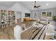 Bright living room with modern decor, a vaulted ceiling, stylish furniture, and access to an adjoining room at 3792 Rolling View Ln, Maiden, NC 28650