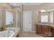 Elegant bathroom with a soaking tub and a seamless glass shower for a spa-like feel at 409 Conaway Ct, Waxhaw, NC 28173