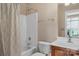 Bright bathroom with a shower-tub combo and a neutral color scheme at 409 Conaway Ct, Waxhaw, NC 28173