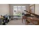 A view from this carpeted living room shows large windows and a grand piano at 409 Conaway Ct, Waxhaw, NC 28173