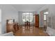 Bright living room featuring hardwood floors, neutral walls and antique buffet table at 409 Conaway Ct, Waxhaw, NC 28173