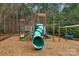 Fun community playground featuring a slide and climbing structure, surrounded by soft mulch at 409 Conaway Ct, Waxhaw, NC 28173