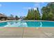 Expansive community pool with clear water, surrounded by lush greenery, perfect for leisurely swims at 409 Conaway Ct, Waxhaw, NC 28173