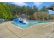 Inviting community pool area with a fun water slide, perfect for Gathering enjoyment and relaxation at 409 Conaway Ct, Waxhaw, NC 28173