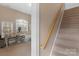 Carpeted staircase and bonus room with natural light, showcasing the home's architectural details at 409 Conaway Ct, Waxhaw, NC 28173