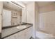 Bright bathroom with a single sink vanity and a tub with shower at 4226 Cornelia Ln, Rock Hill, SC 29732