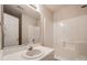 Bright bathroom with a white single sink vanity and a tub with shower at 4226 Cornelia Ln, Rock Hill, SC 29732