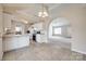 Open-concept kitchen with white cabinetry, stainless steel appliances, and a view into the living area at 4226 Cornelia Ln, Rock Hill, SC 29732