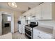 Bright kitchen featuring white cabinets, stainless steel appliances, and ample counter space at 4226 Cornelia Ln, Rock Hill, SC 29732