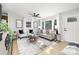 Inviting living room featuring ample natural light, neutral tones, and stylish, comfortable seating at 4308 Welling Ave, Charlotte, NC 28208