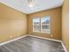 Bright bedroom offering natural light from two windows and a ceiling fan at 6420 Cambridge Dr, Harrisburg, NC 28075