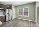 Bright kitchen with stainless steel appliances, ample counter space, and modern cabinets at 6420 Cambridge Dr, Harrisburg, NC 28075