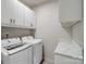 Laundry room features side-by-side washer and dryer, counter space and storage at 6420 Cambridge Dr, Harrisburg, NC 28075