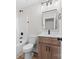 Bathroom featuring a modern wood vanity with quartz counters and black hardware at 813 Carrid Dr, Gastonia, NC 28052