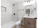 A bathroom with marble-tiled shower, modern fixtures, and bright white vanity at 813 Carrid Dr, Gastonia, NC 28052