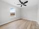 Bedroom with new floors, neutral colors and a window overlooking the backyard at 813 Carrid Dr, Gastonia, NC 28052