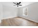 A well-lit room with light hardwood floors and a window providing natural light at 813 Carrid Dr, Gastonia, NC 28052