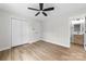 Bright bedroom with hardwood floors, ceiling fan, and closet, with an ensuite bathroom at 813 Carrid Dr, Gastonia, NC 28052