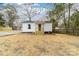 Charming single-story home featuring a covered porch and fresh white siding, set in a spacious yard at 813 Carrid Dr, Gastonia, NC 28052