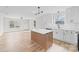 Kitchen with white cabinetry, stainless appliances, a kitchen island, and updated fixtures at 813 Carrid Dr, Gastonia, NC 28052