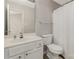 Well-lit bathroom with a large mirror, white cabinets, and a shower with tub at 9562 Littleleaf Dr, Charlotte, NC 28215