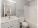 Bright bathroom featuring a sink, a toilet, and a shower with tub at 9562 Littleleaf Dr, Charlotte, NC 28215